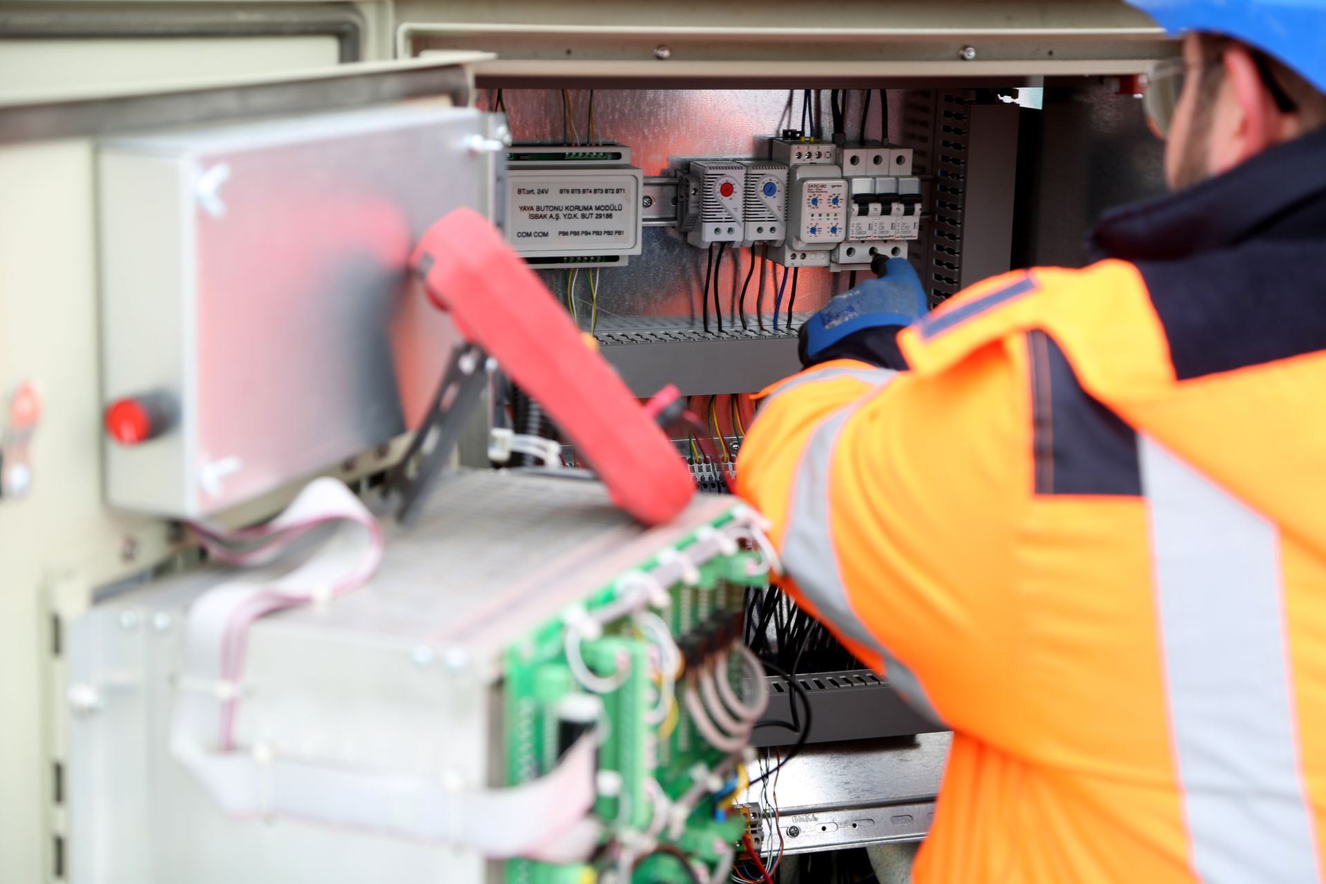 SDK.54 engineer inspecting an electrical panel